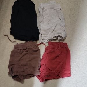 Set of Four Casual Linen Shorts in Black, Tan,  Brown, and Red/Orange.